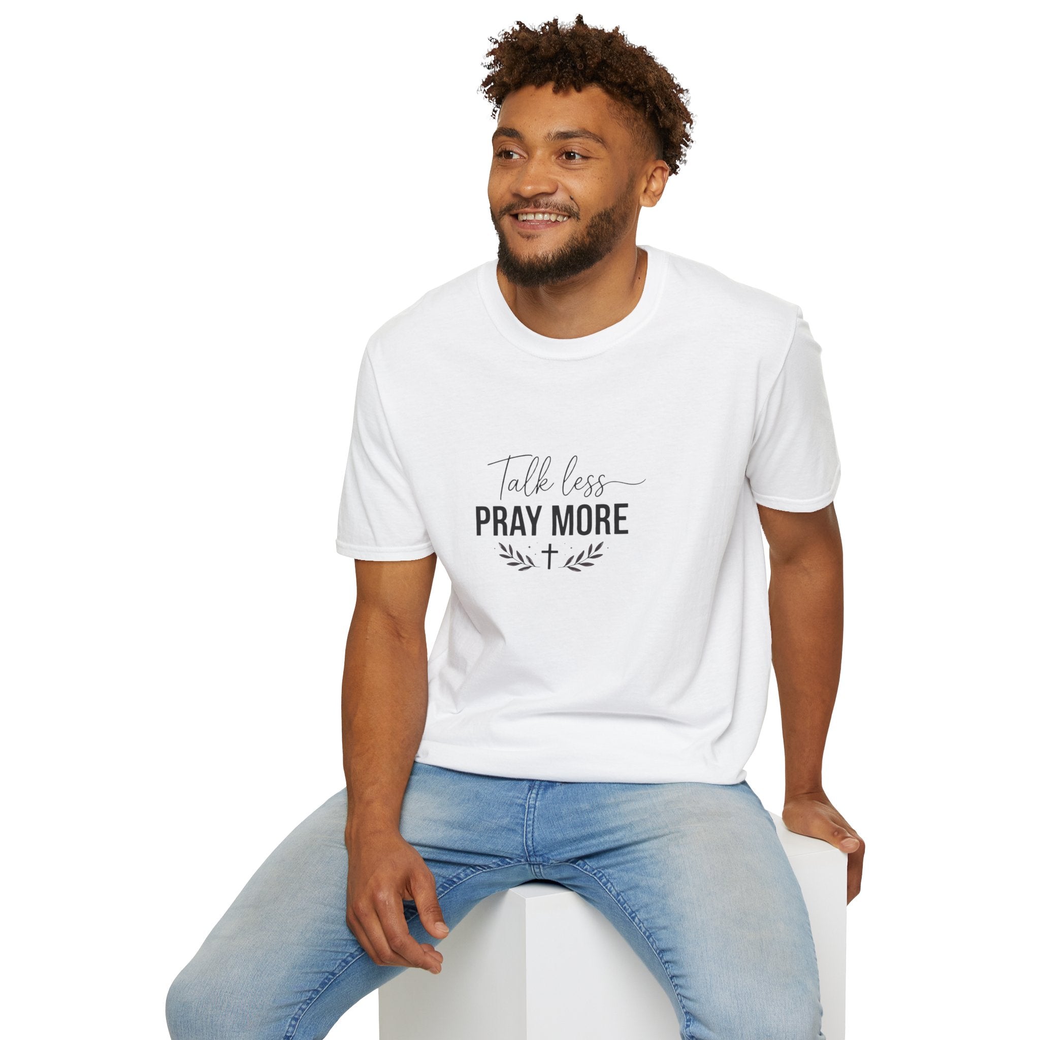 Man wearing a white t-shirt with 'Est. 2026' text and graphic, sitting on a white stool against a white background.