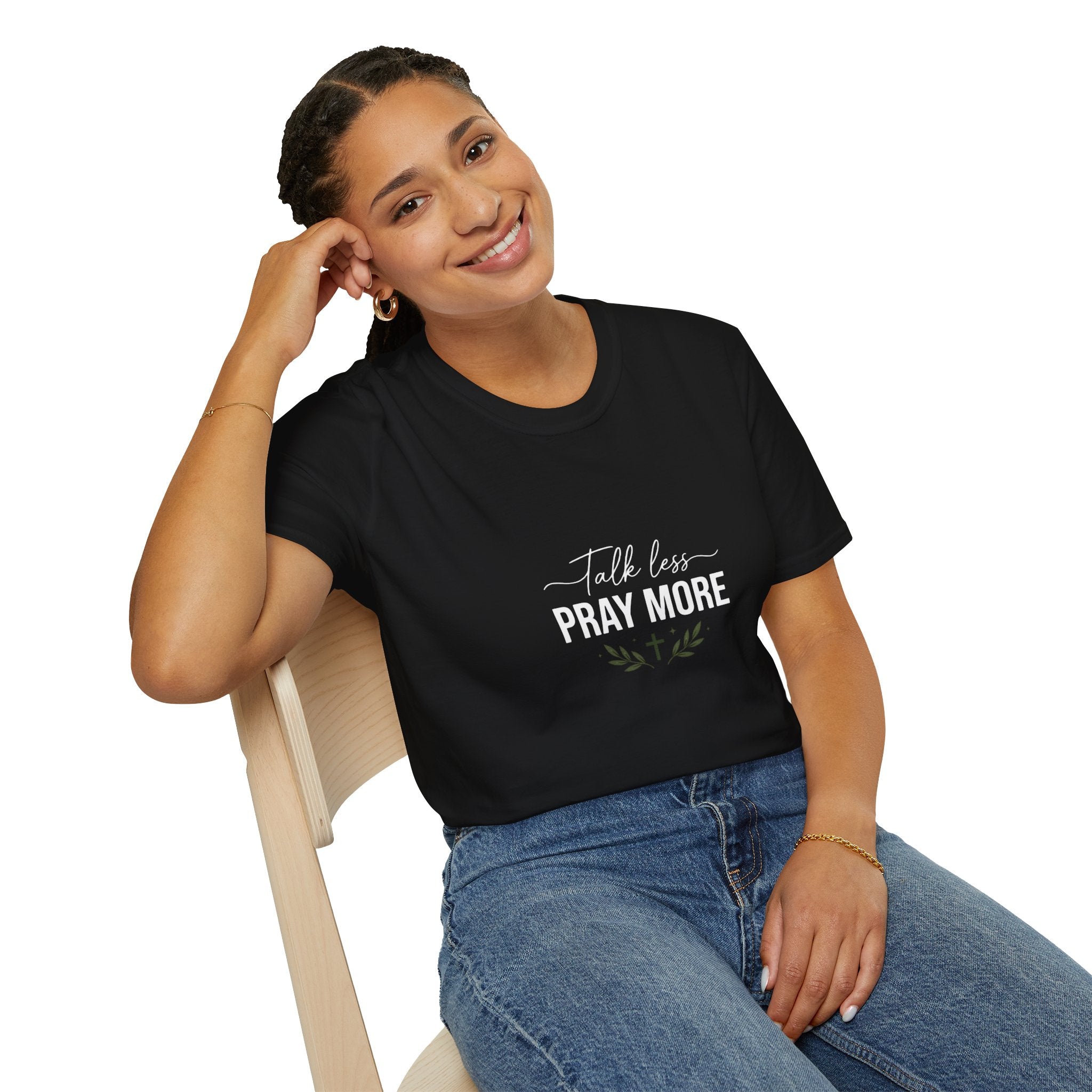 Woman wearing a black t-shirt with 'HER STORY' text, sitting on a chair.
